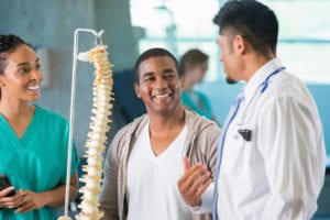 A Group of doctor discussing on spinal cord