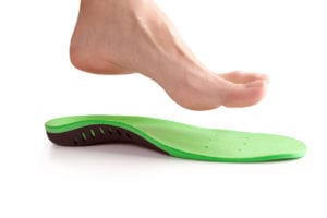 orthopedic insole and female leg