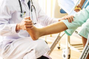 doctor helping with foot and ankle pain