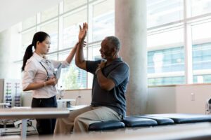 shoulder doctor checks patient's range of motion